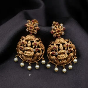 antique lakshmi earrings with peacock and floral bloom patterns